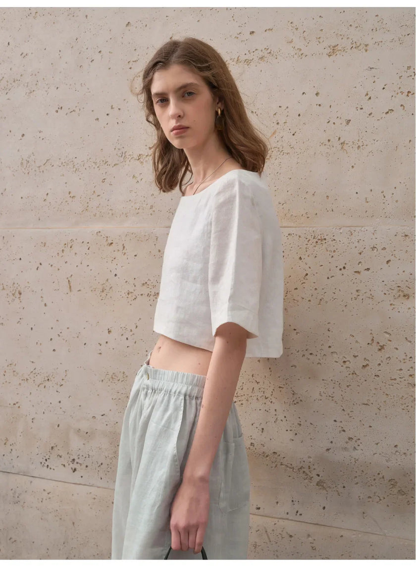 FJØRNA women's linen crop top with short sleeves, lightweight and breathable, perfect for casual summer outfits.