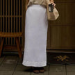 FJØRNA women's linen crop top with short sleeves and V-neck, lightweight and breathable for casual summer wear.