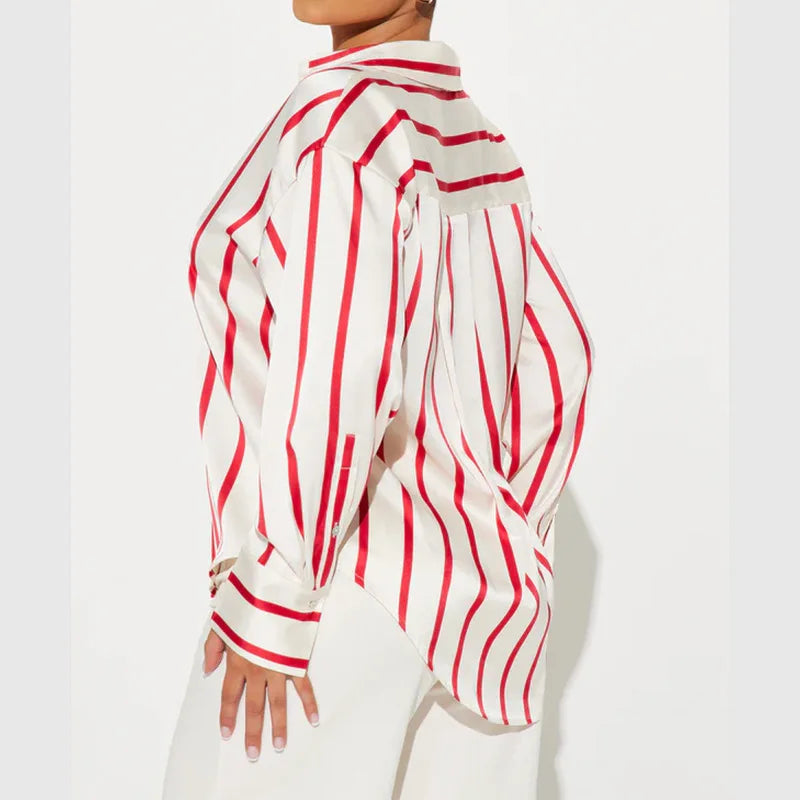 FJØRNA satin blouse for women, elegant women's top with smooth, shiny fabric and classic design, shown in the image.