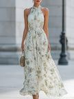 FJØRNA Fiona flowy halter maxi dress featuring a lightweight fabric and elegant design, shown on a model.