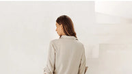 FJØRNA women's linen top with ruffle detail, lightweight and stylish blouse featuring feminine design and breathable fabric.
