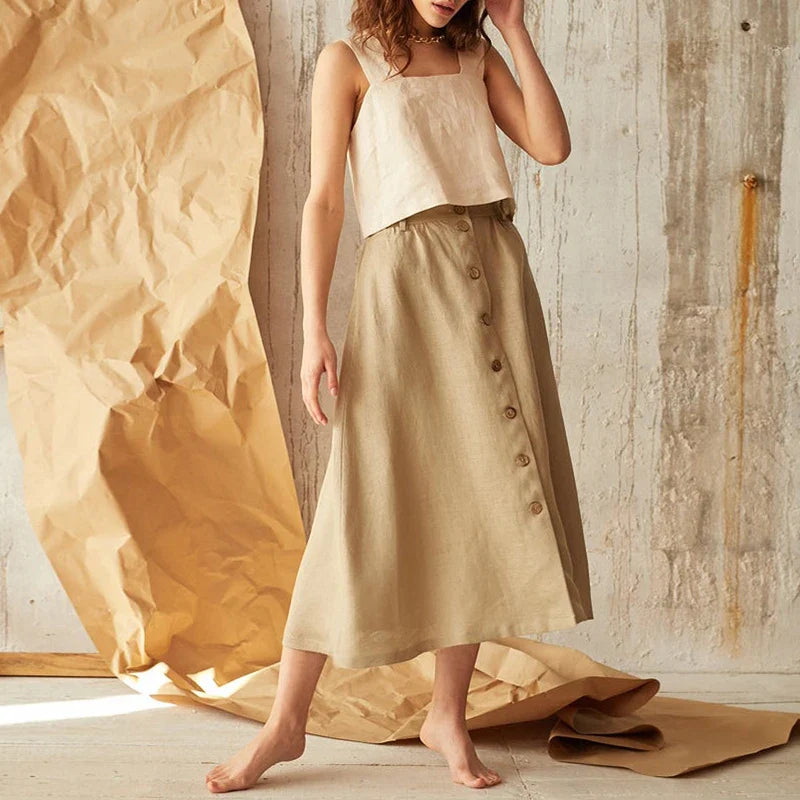 FJØRNA square neck linen cropped tank top in beige, showcasing the fitted style and breathable fabric.