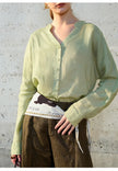 FJØRNA women's linen V-neck shirt, lightweight and breathable top with long sleeves, in natural linen fabric.