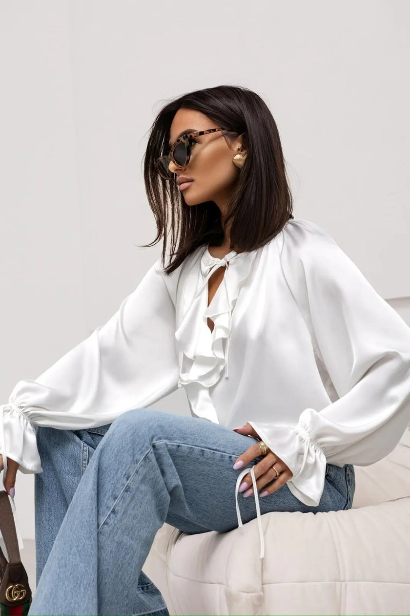 FJØRNA satin blouse for women featuring elegant ruffle details and a stylish top design, perfect for sophisticated outfits.