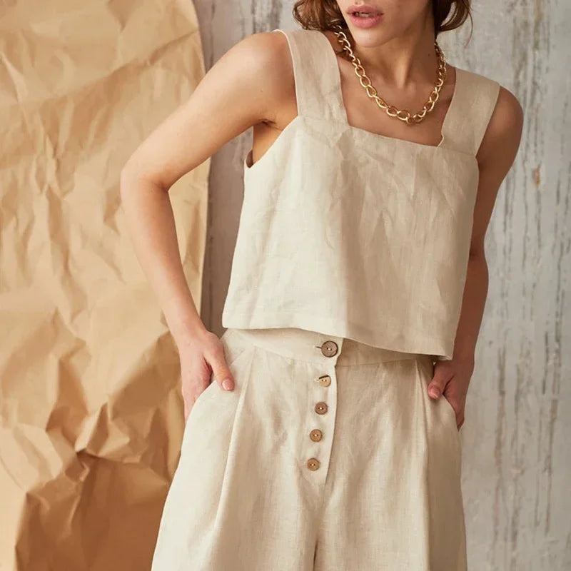 FJØRNA square neck linen cropped tank top displayed on a hanger, showcasing its lightweight, breathable fabric and stylish design.