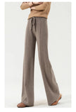 Women’s Merino wool wide-leg high-waist trousers by FJØRNA, showing the soft knit fabric and relaxed fit on a model.