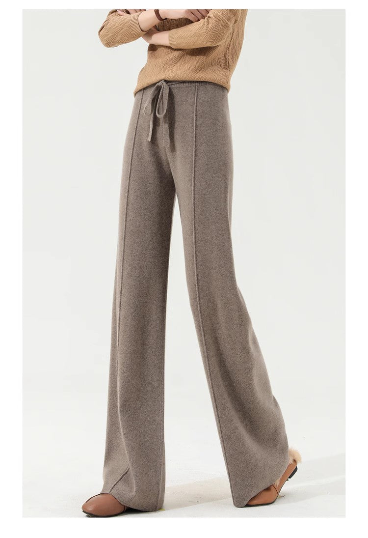 Women’s Merino wool wide-leg high-waist trousers by FJØRNA, showing the soft knit fabric and relaxed fit on a model.