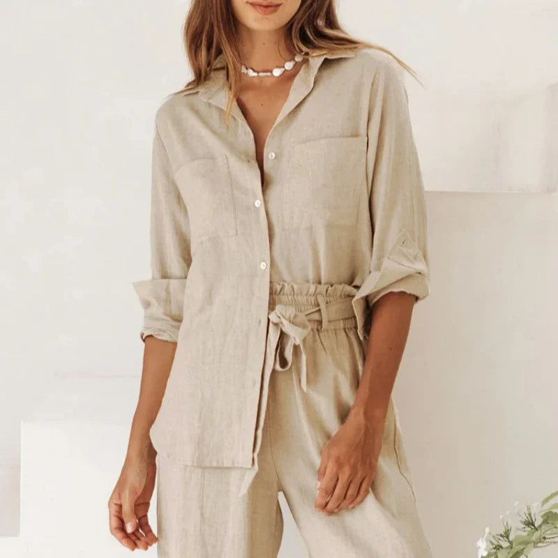FJØRNA extra-large linen shirt with spacious pockets, shown in a relaxed fit with a natural linen texture.