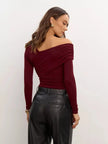 Women’s off-shoulder cotton top by FJØRNA, showcasing a stylish, casual design with shoulder-baring style and soft fabric.