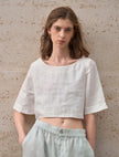 FJØRNA women's linen crop top with short sleeves, lightweight and breathable fabric, stylish and perfect for warm weather.
