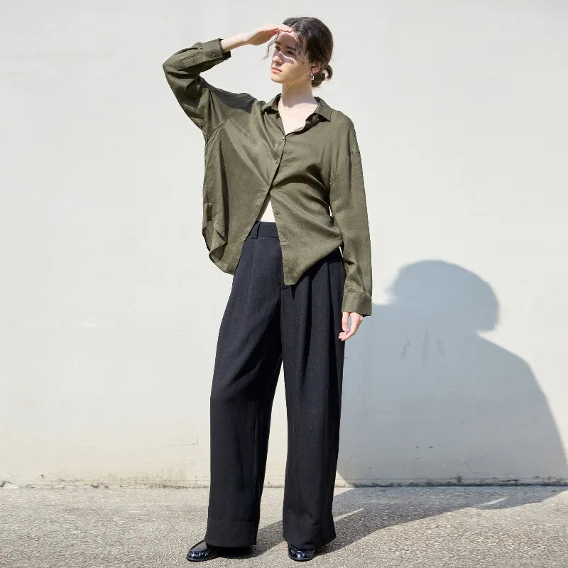 Women’s linen shirt by FJØRNA, lightweight and breathable top featuring a relaxed fit and natural linen fabric.