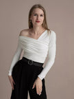 Women’s off-shoulder cotton top by FJØRNA featuring a relaxed fit and stylish design, shown on a model.