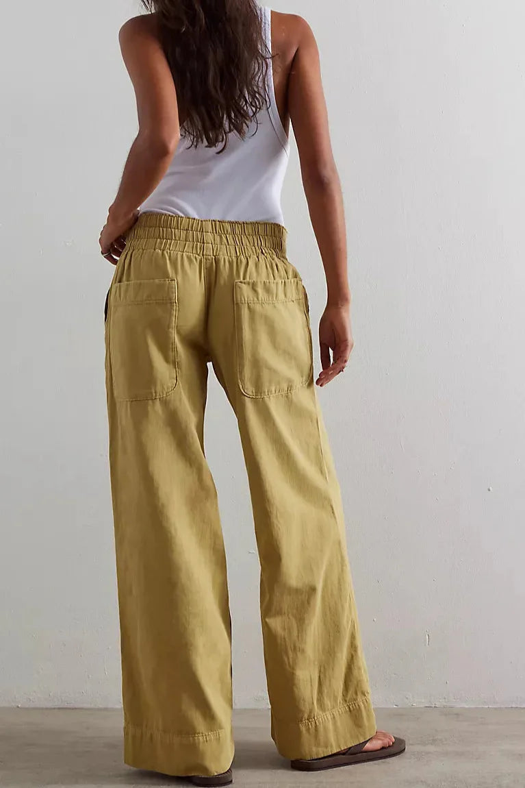 Women's wide-leg denim jeans by FJØRNA, stylish pants with a relaxed fit and classic blue denim appearance.