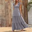 FJØRNA Tiffany tiered ruffle maxi dress in white, flowing fabric with layered ruffles, elegant and perfect for summer occasions.