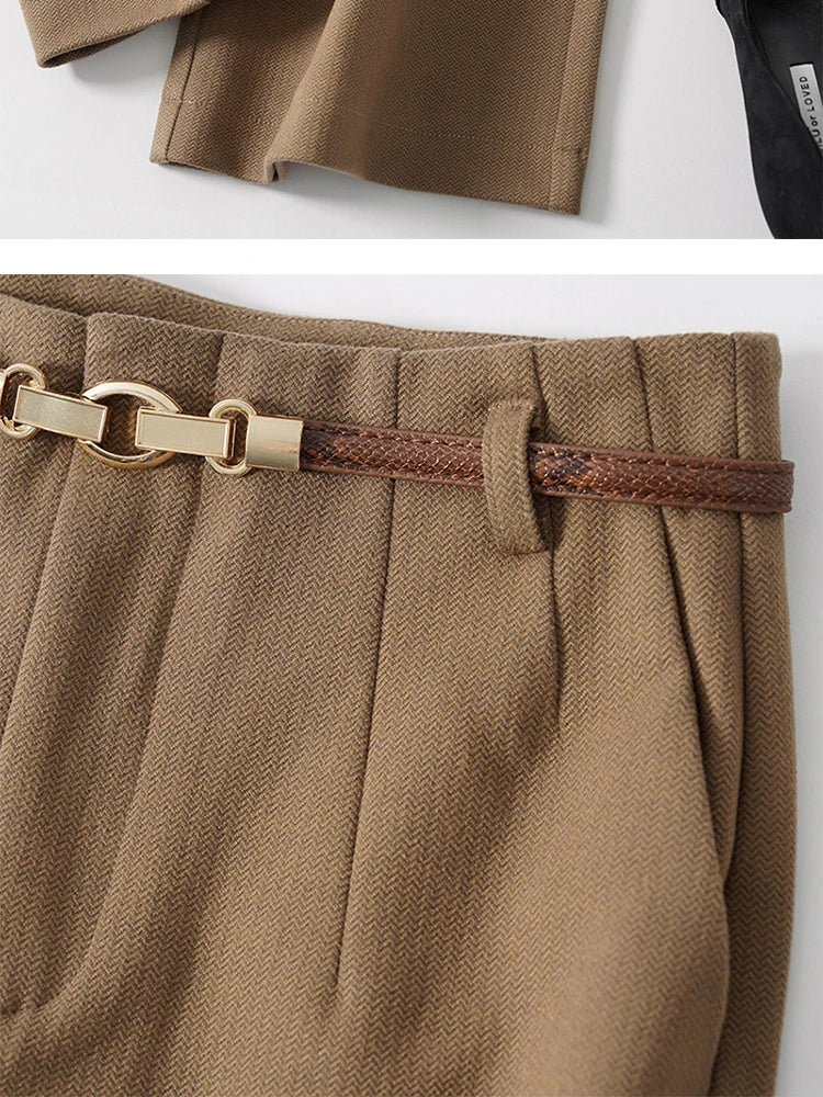 Women’s wool wide-leg trousers by FJØRNA, high waist and tailored fit, shown on a model in a stylish outdoor setting.