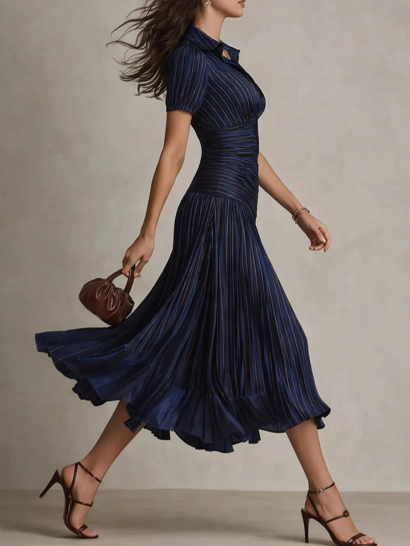 FJØRNA Zaffira pleated white midi dress with a flowy, elegant design and pleated fabric, perfect for stylish occasions.
