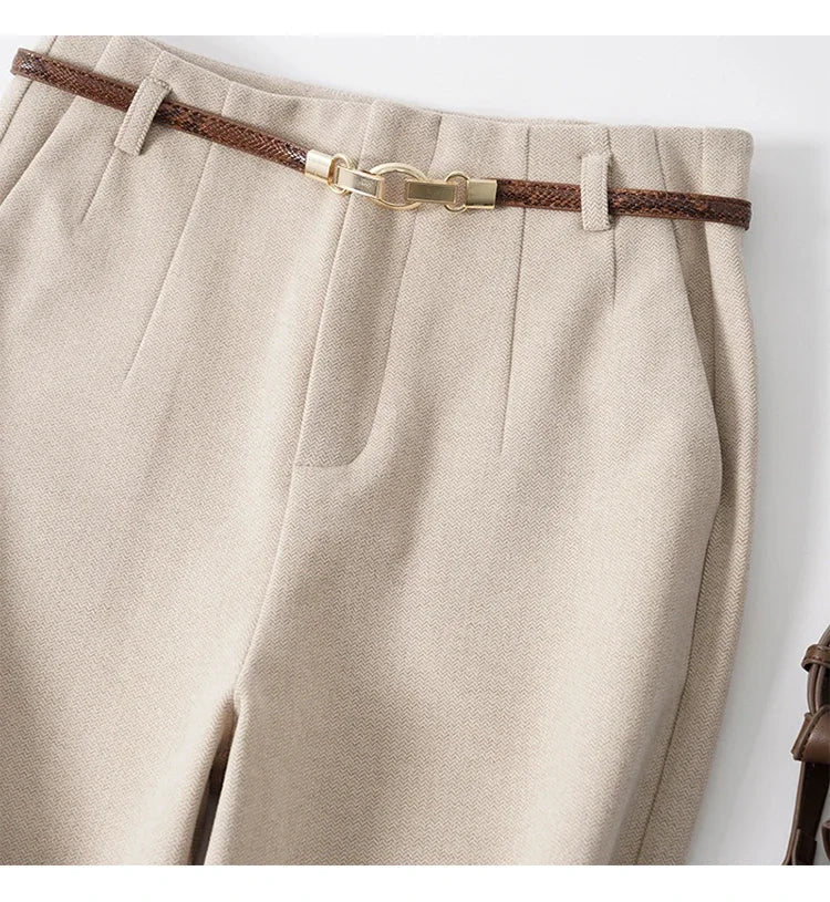 Women’s wide-leg wool trousers by FJØRNA with high waist and tailored fit, shown in a natural fabric and stylish cut.