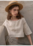 FJØRNA women's linen crop top with short sleeves, lightweight and breathable for casual summer wear.