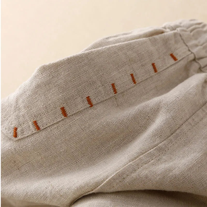 FJØRNA linen wide-leg women's trousers with drawstring waist, lightweight and comfortable for casual wear.