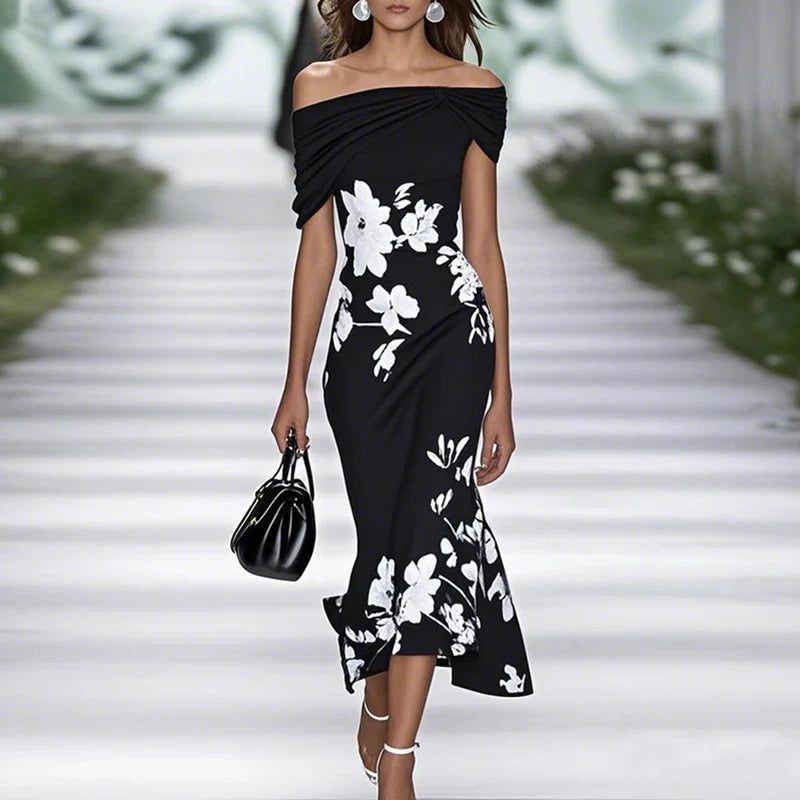 FJØRNA fitted off-shoulder mermaid midi dress with draped neckline and floral pattern, showcasing elegant evening wear style.