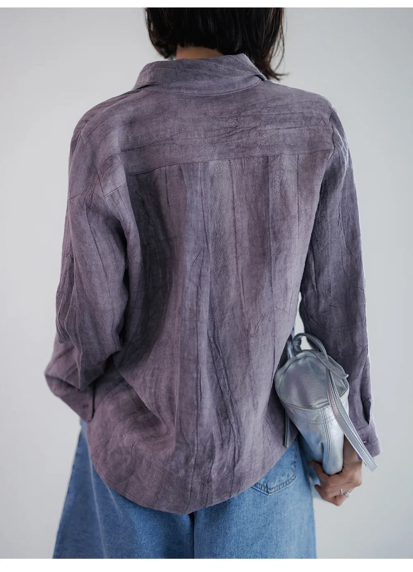 FJØRNA women's linen shirt with pleated design, featuring a relaxed fit and lightweight fabric, displayed on a hanger.