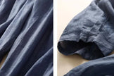 FJØRNA linen tapered trousers for women, showing the relaxed fit and light fabric in a natural pose.
