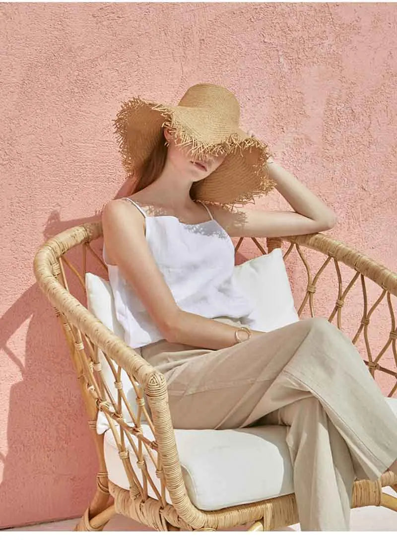 FJØRNA satin-trimmed linen camisole top with delicate straps and relaxed fit, showcased on a neutral background.
