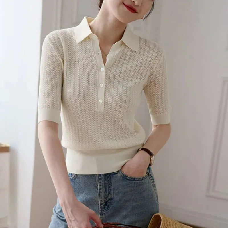 FJØRNA ribbed knit polo blouse for women, showing a close-up of the textured fabric and classic polo collar.