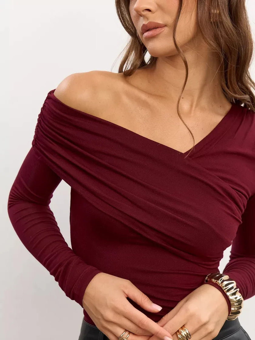 Women’s off-shoulder cotton top by FJØRNA, featuring a relaxed fit and stylish design, shown in a light-colored fabric.