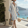 FJØRNA floral summer mini dress for women with V-neck, flowy and breathable fabric, perfect for warm weather.