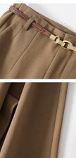 Women's wool wide-leg trousers by FJØRNA, high waist, tailored fit, and soft texture, suitable for chic, comfortable styling.