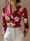 FJØRNA women's floral satin summer blouse with short sleeves and a relaxed fit, featuring a vibrant floral pattern.