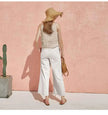 FJØRNA satin-trimmed linen cami featuring lightweight linen fabric with elegant satin trim, shown in a relaxed fit.