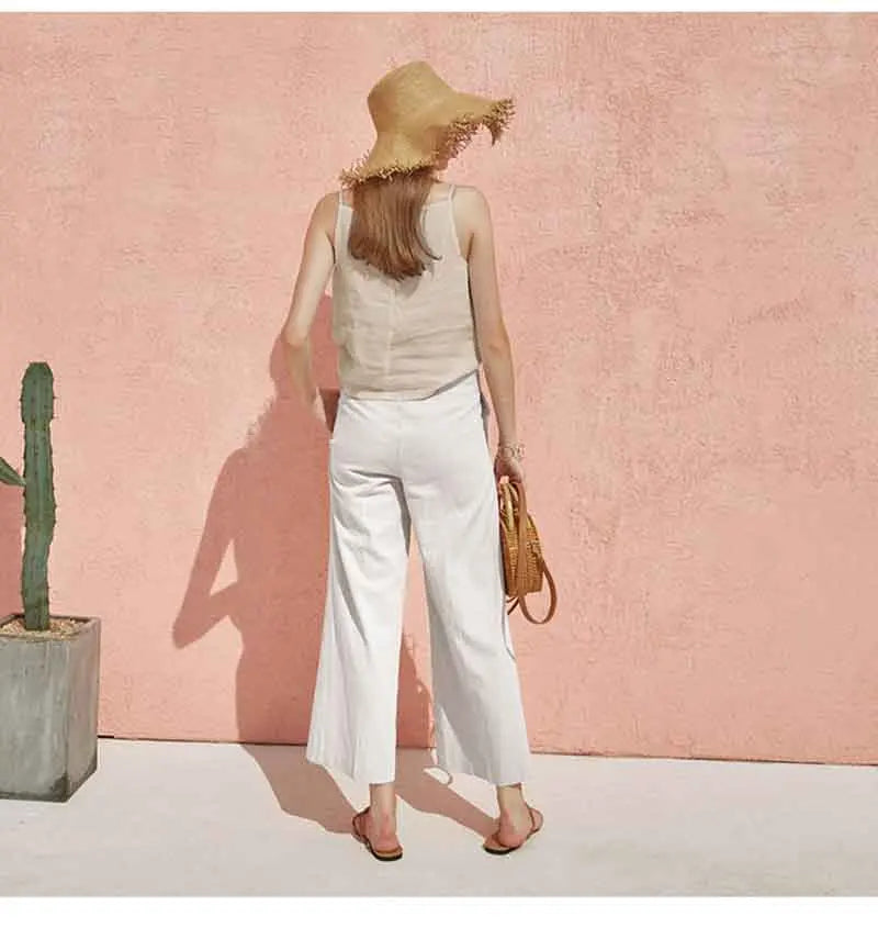 FJØRNA satin-trimmed linen cami featuring lightweight linen fabric with elegant satin trim, shown in a relaxed fit.