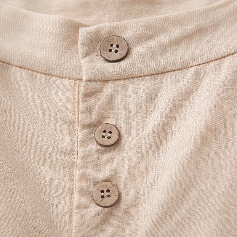 Women’s wide-leg knit trousers by FJØRNA with elastic waist and relaxed fit, shown in natural beige color.