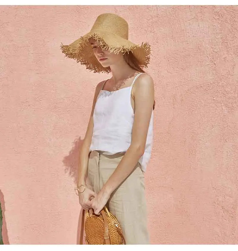 FJØRNA satin-trimmed linen camisole featuring delicate satin accents and lightweight, breathable linen fabric.