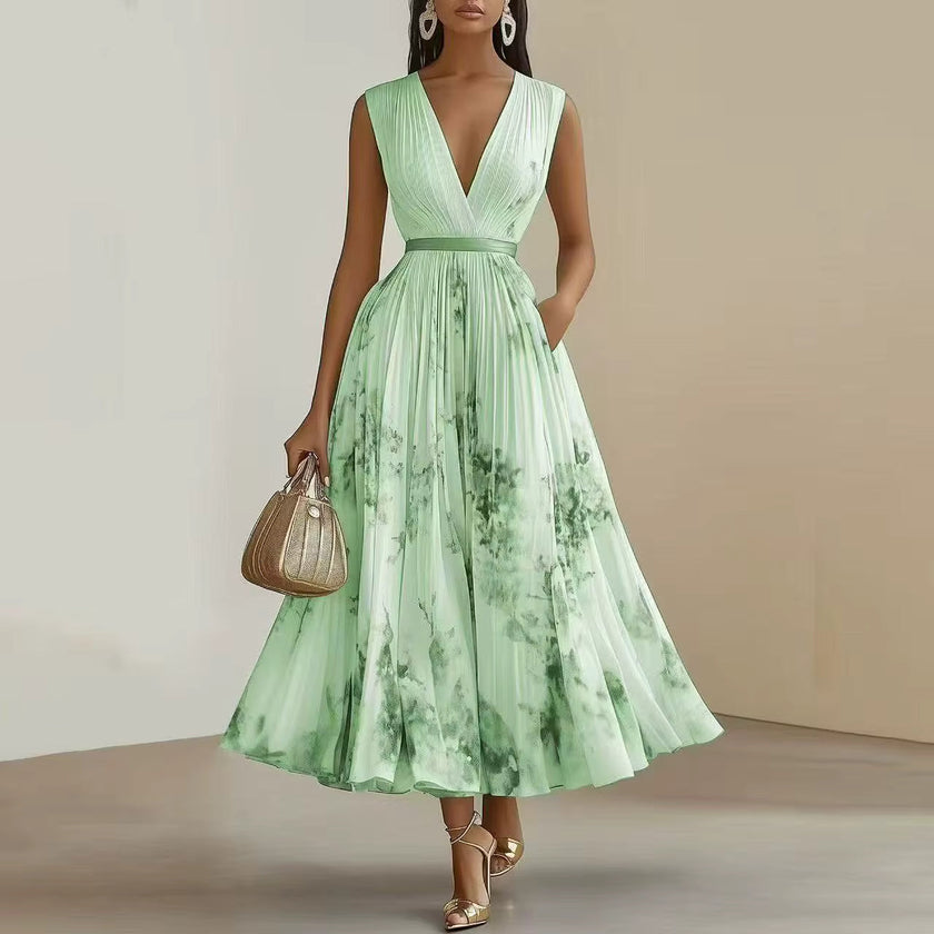 FJØRNA pleated belted A-line maxi dress for women, featuring a flowing design and waist belt, ideal for elegant occasions.