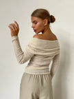 FJØRNA women's ribbed knit off-shoulder top, featuring a fitted design and soft fabric in a stylish, casual look.