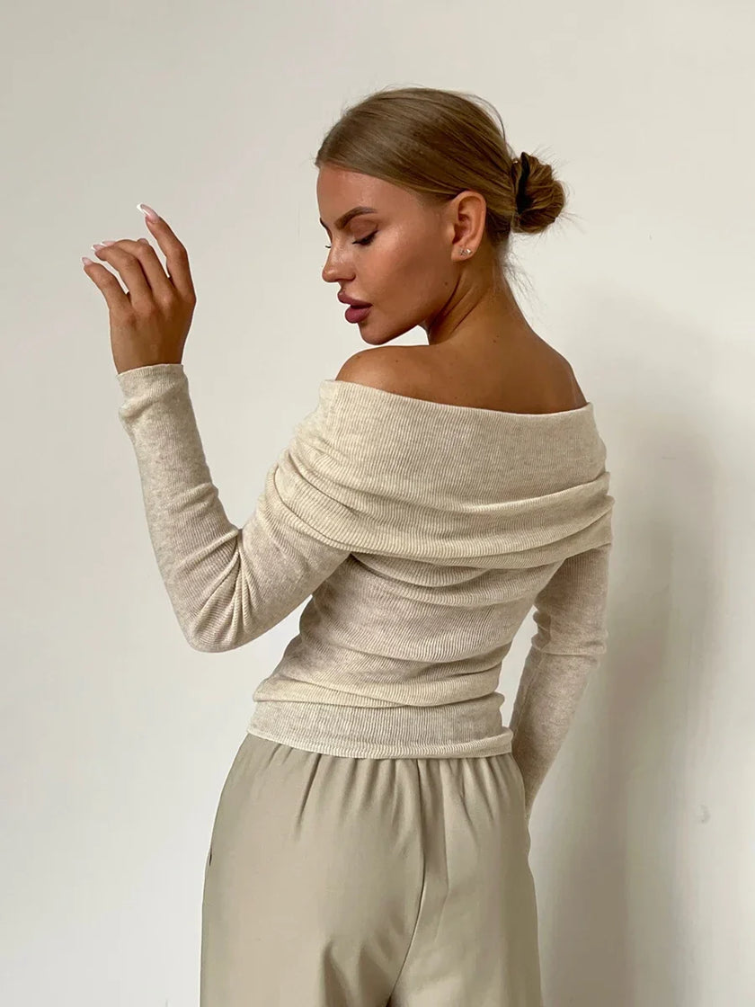 FJØRNA women's ribbed knit off-shoulder top, featuring a fitted design and soft fabric in a stylish, casual look.