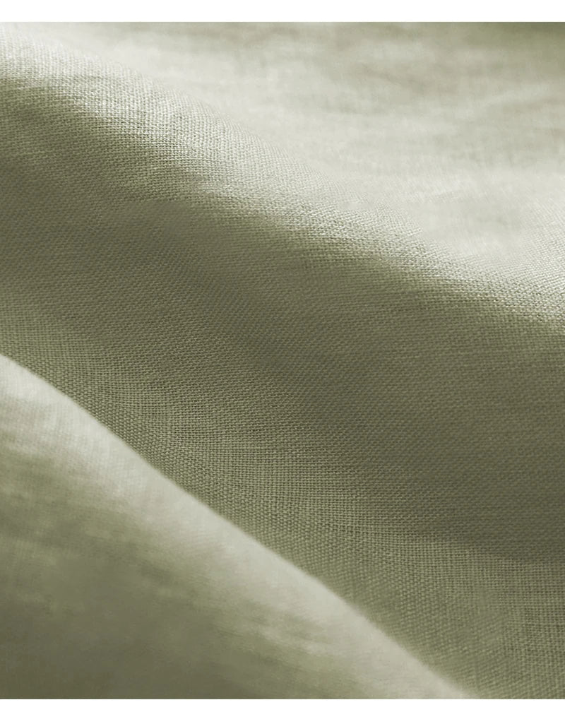 FJØRNA Petal Sleeve Linen T-Shirt featuring soft, lightweight fabric and elegant sleeve design in natural linen color.