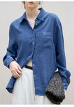 FJØRNA women's linen blend shirt, stylish women's top with lightweight fabric and relaxed fit, displayed on a hanger.
