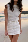 FJØRNA women's sleeveless knit tank top displayed on a model, featuring a fitted, ribbed design perfect for casual wear.