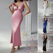 FJØRNA elegant sleeveless V-neck empire waist midi dress with flowing fabric and stylish design, perfect for formal occasions.