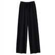 FJØRNA women's merino wool wide-leg high-waist trousers, featuring a smooth fit and classic design, shown on a model.