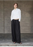 FJØRNA women's linen crop top with pleated design and long sleeves, featuring a stylish, breathable fabric for casual wear.