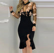FJØRNA mesh ruffle dress with embroidered sequin details, elegant and stylish for special occasions.
