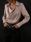 Women’s satin long sleeve shirt by FJØRNA, stylish and smooth fabric, close-up of the elegant satin top with button details.