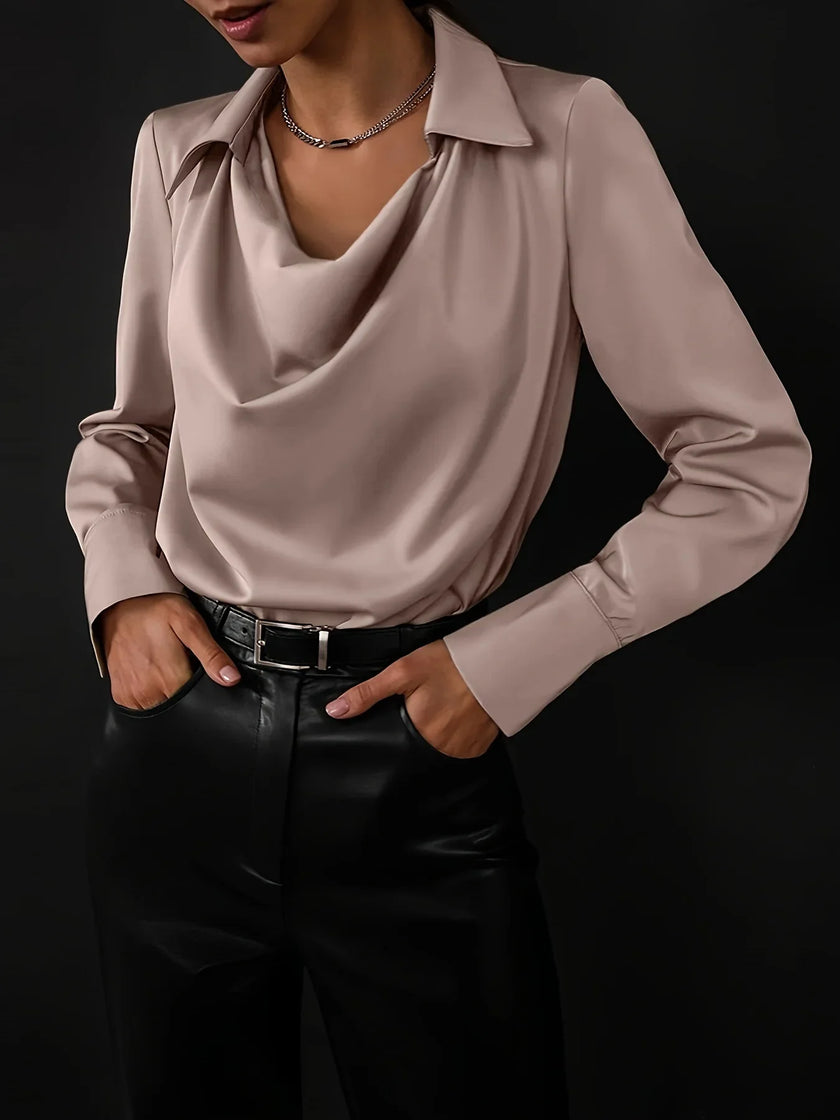 Women’s satin long sleeve shirt by FJØRNA, stylish and smooth fabric, close-up of the elegant satin top with button details.