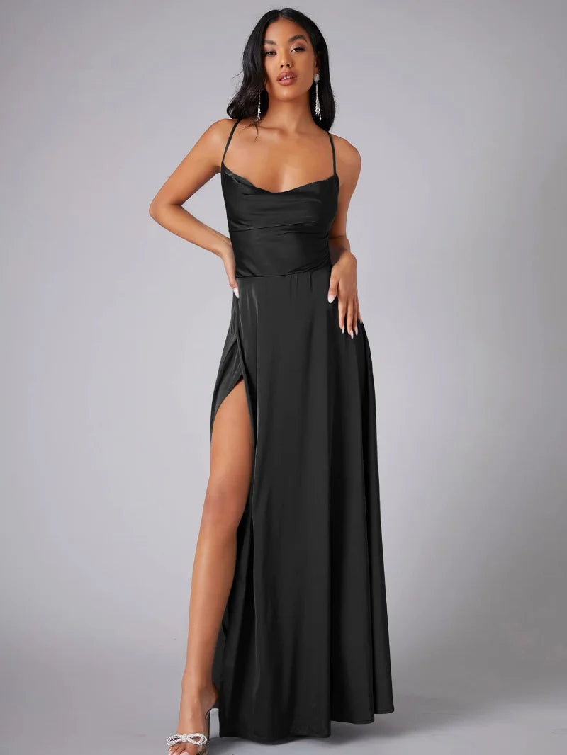 FJØRNA white maxi dress with spaghetti straps, flowing fabric, and elegant design perfect for evening wear and summer occasions.