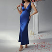FJØRNA elegant sleeveless V-neck empire waist midi dress with flowy fabric and midi length, perfect for sophisticated occasions.
